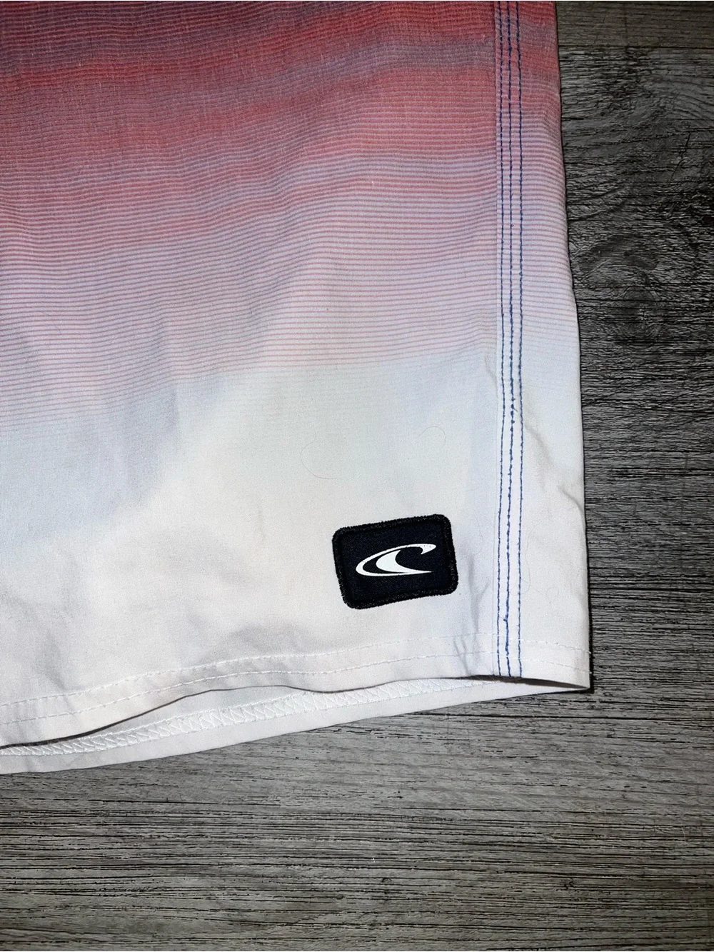 O'Neill Red-to-White Ombre Board Shorts with Blue Waistband
